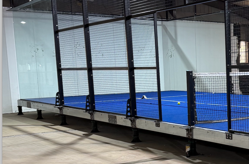 Toshimi Sports indoor padel court installed on an adjustable pedestal suspension platform